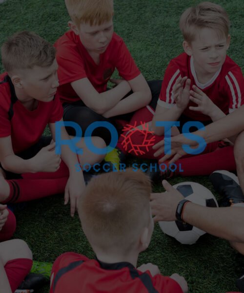 Youth soccer players practicing drills at Roots Soccer School academy